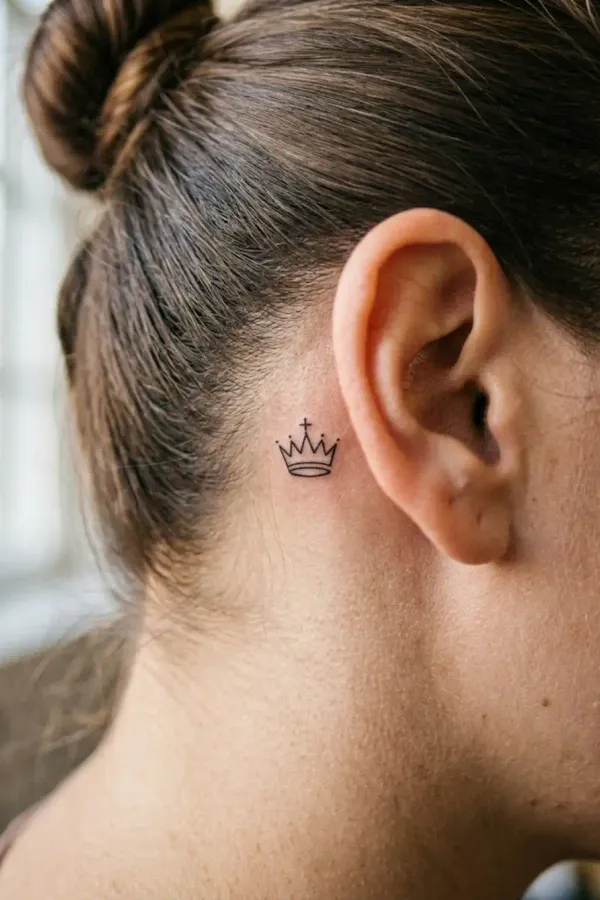 Chess tattoo behind the ear, hair fully pulled back