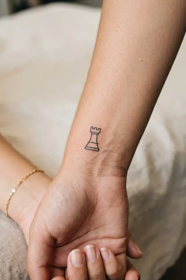 Rook tattoo on the wrist, small version