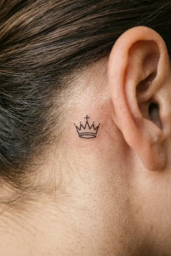 Chess tattoo behind the ear in natural daylight